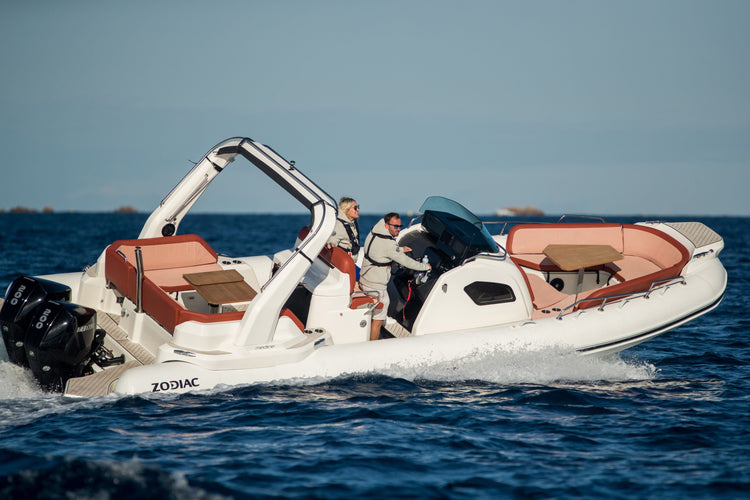 RIB boat gliding through the water, showcasing its stability and performance.