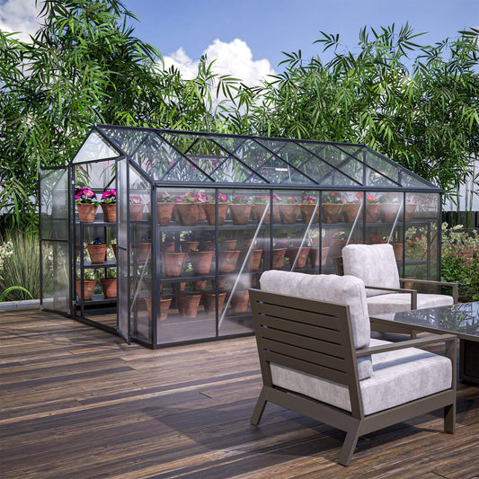 Greenhouse with plants on a wooden deck with outdoor furniture