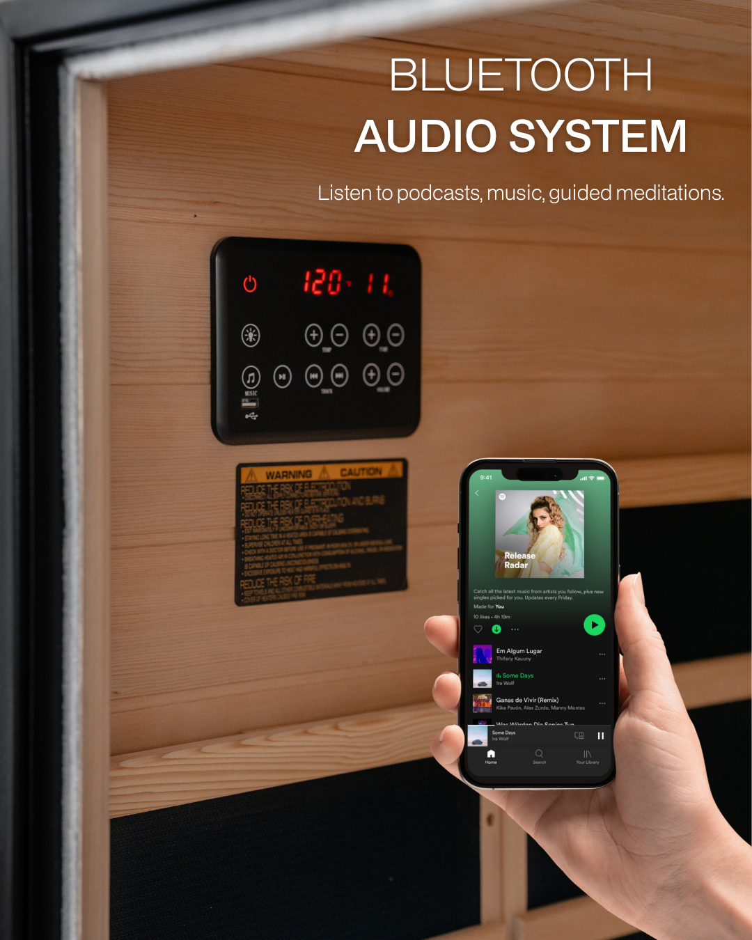 Hand holding a smartphone with a music app displayed, next to a sauna with a Bluetooth audio system control panel.