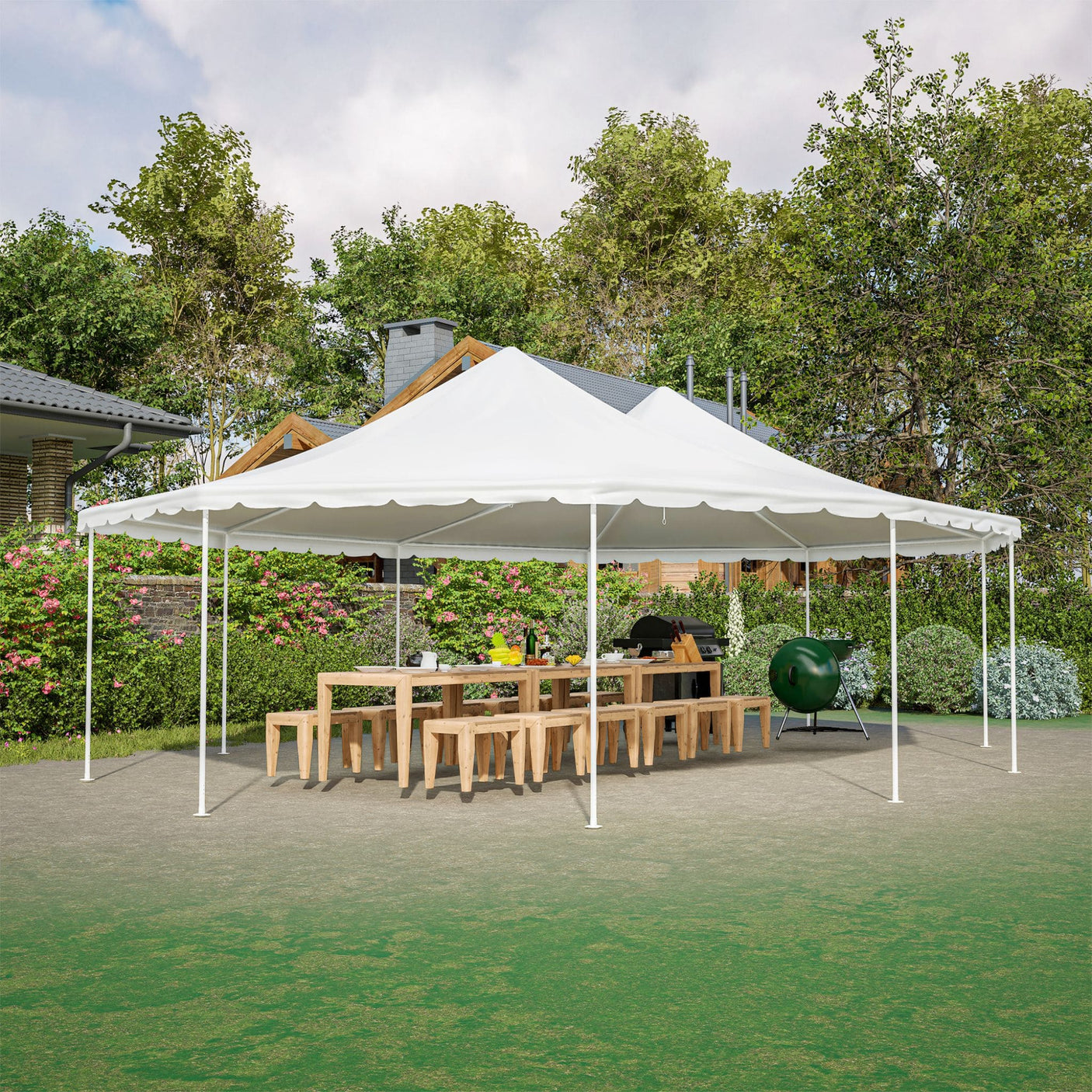 White outdoor canopy tent set up in a garden with tables and chairs underneath.