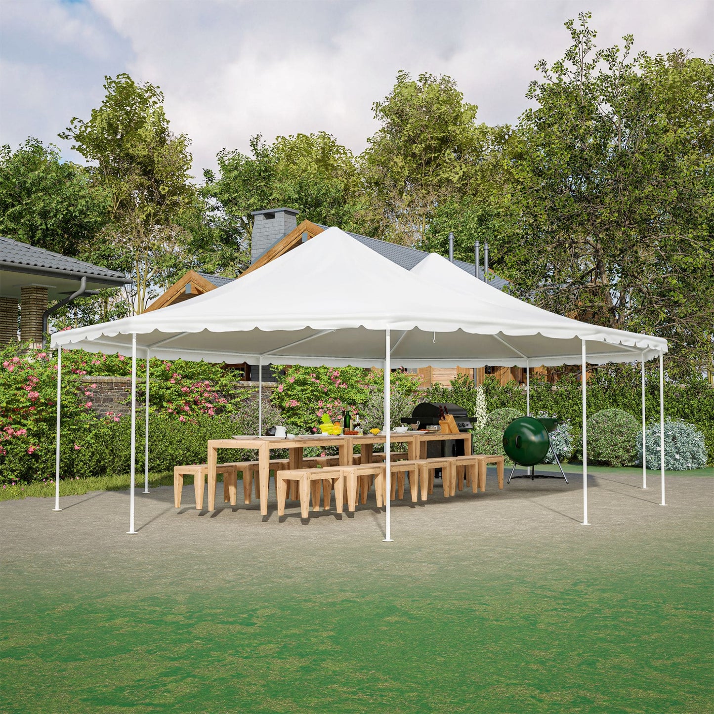 White outdoor canopy tent set up in a garden with tables and chairs underneath.