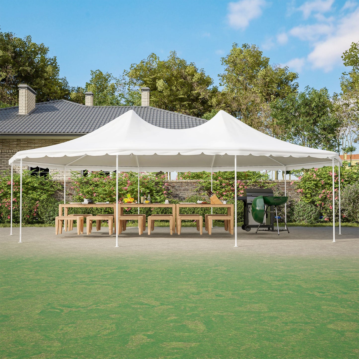 White outdoor canopy tent set up on a grassy area with a house and trees in the background.