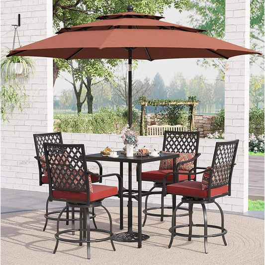 Outdoor patio set with table and chairs under a large umbrella on a patio.
