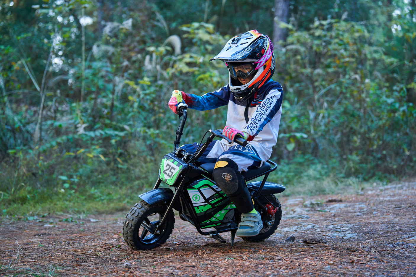 Child riding the MotoTec 24v 250w Electric Mini Bike Black safely outdoors
