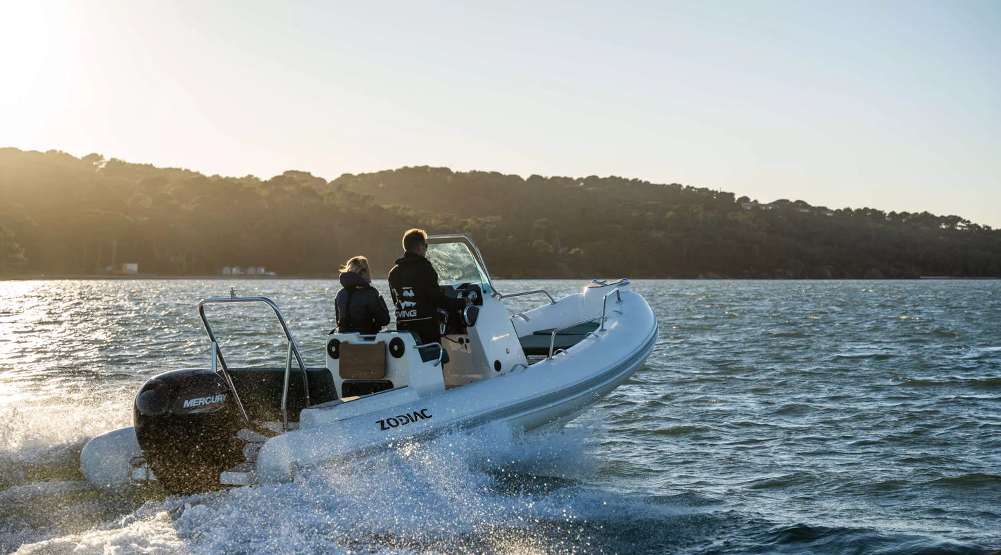 Zodiac Medline 5.8 RIB gliding across the water with family onboard