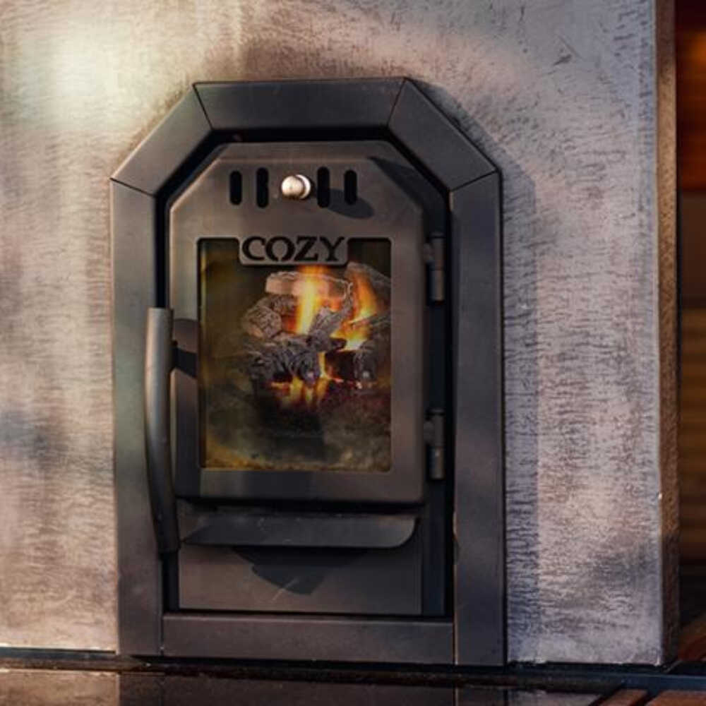 A black sauna stove with sauna stones on the exterior and a digital display, branded as 'COZY'