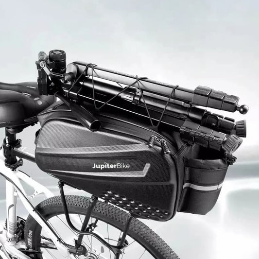 Bicycle with mounted JupiterBike bag and accessories on a light gray background