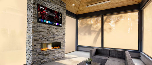 Modern living room with a stone fireplace and MirageVision Outdoor TV.
