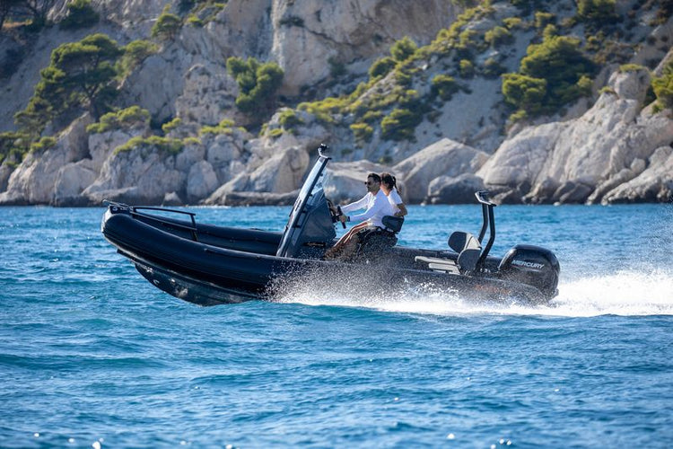 Durable Zodiac RIB boat cutting through ocean waves, showcasing its performance and stability.