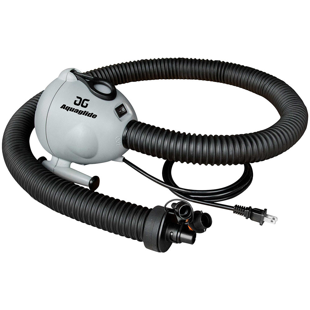 Inflating a water trampoline with the Aquapark 110V 7.3 Pump, a high-capacity electric pump, on a lake shore.