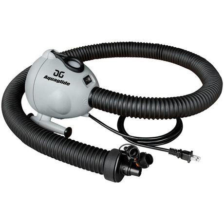 Inflating a water trampoline with the Aquapark 110V 7.3 Pump, a high-capacity electric pump, on a lake shore.