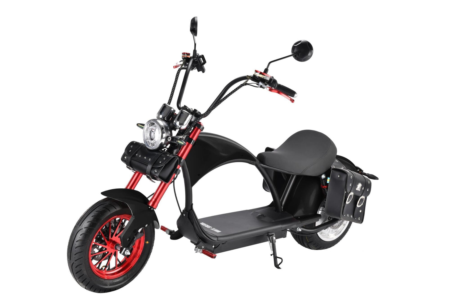 Electric motorcycle cruising through a scenic coastal road.
