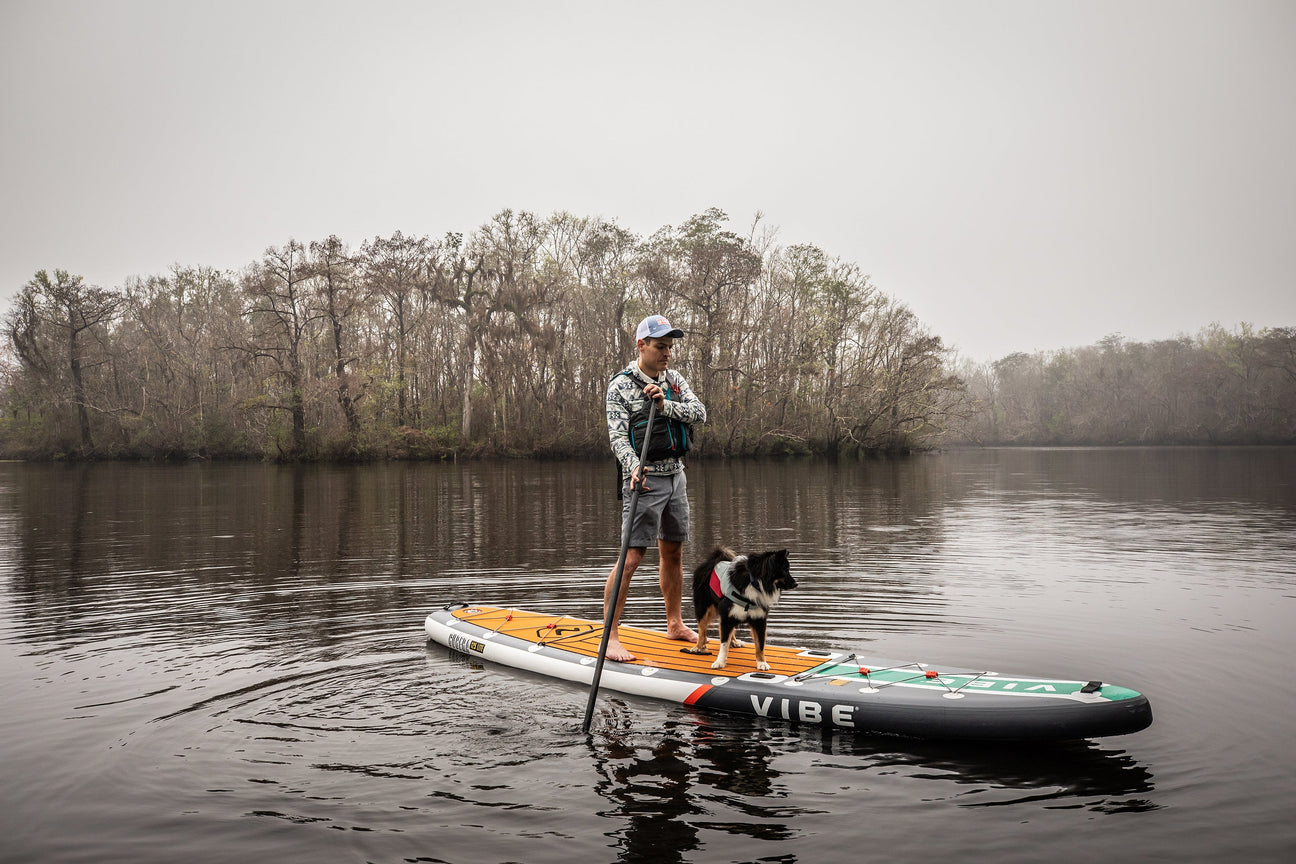 Stand-up paddle board on a calm lake, perfect for water adventures.