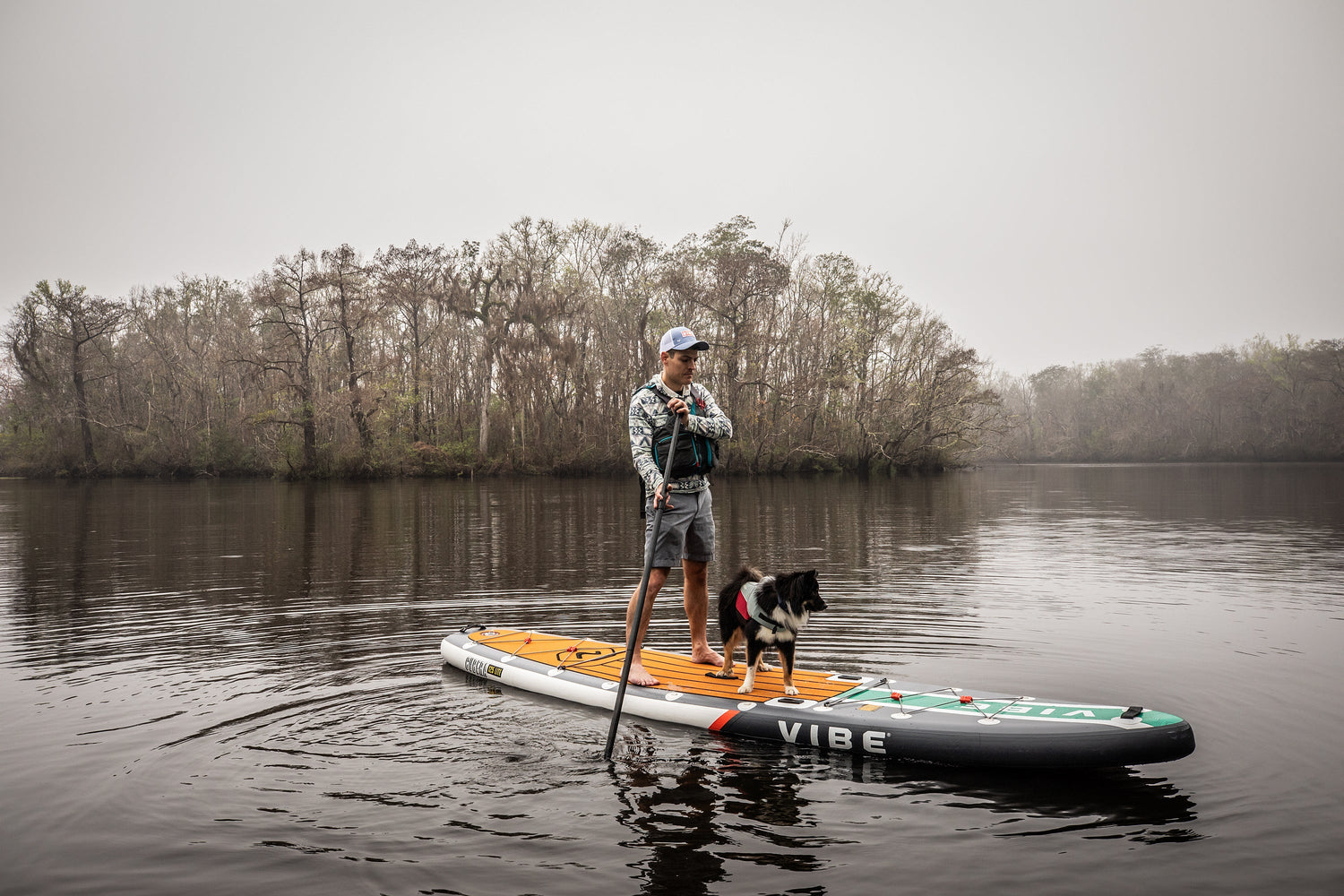 Stand-up paddle board on a calm lake, perfect for water adventures.