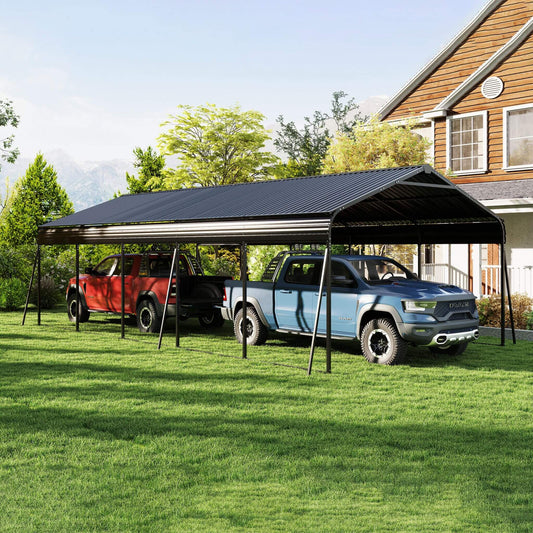 Two trucks parked under a portable carport on a grassy area with a house in the background.