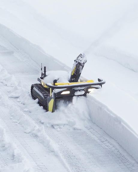 Yarbo Core clearing snow with the 2-stage snow blower module