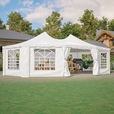 White outdoor canopy tent with curtains set up in a garden area with trees and houses in the background.