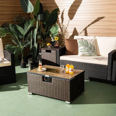 Outdoor patio set with furniture, plants, and drinks on a wooden deck.