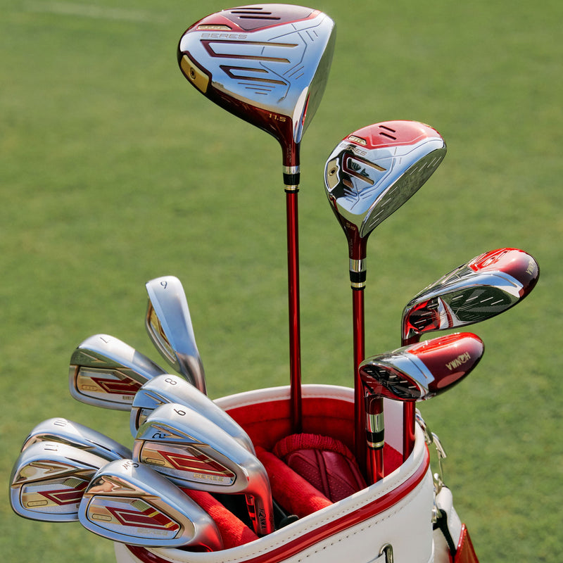 Golf clubs in a red and white bag on a grassy background