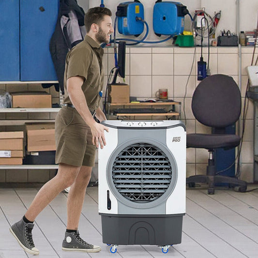 Person holding a portable air conditioner in a workshop setting