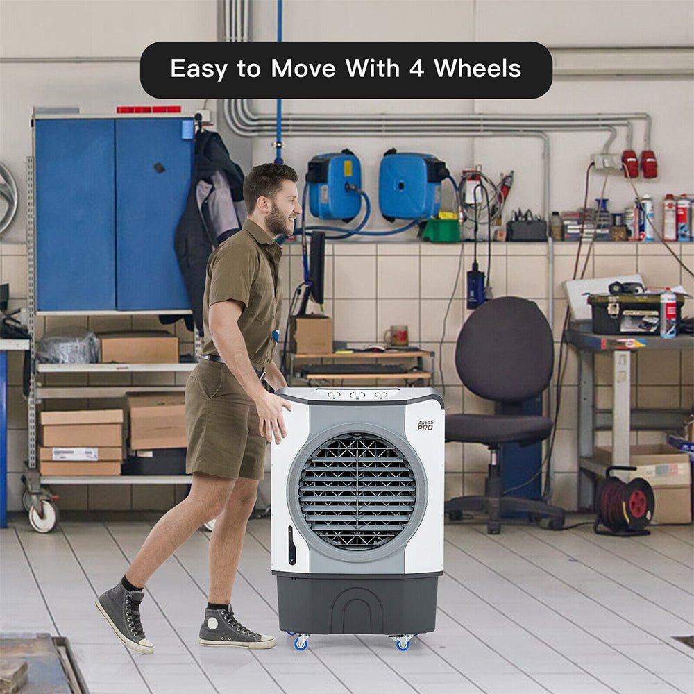Person moving a portable air cooler with wheels in a workshop setting