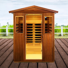 Wooden sauna with open door on a wooden deck, greenery in the background