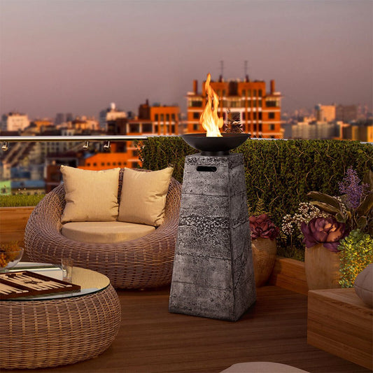 Outdoor patio with wicker furniture, fire pit, and city skyline view.
