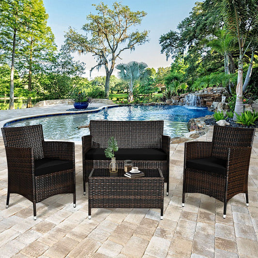 Outdoor patio set with three chairs and a table by a pool