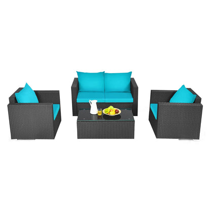 Outdoor furniture set with blue cushions and a glass table on a white background