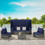 Outdoor patio set with blue cushions and a canopy on a sunny day.