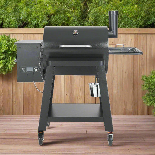 Black barbecue grill on a wooden deck with greenery in the background