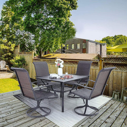 Outdoor patio set with table and chairs on a wooden deck