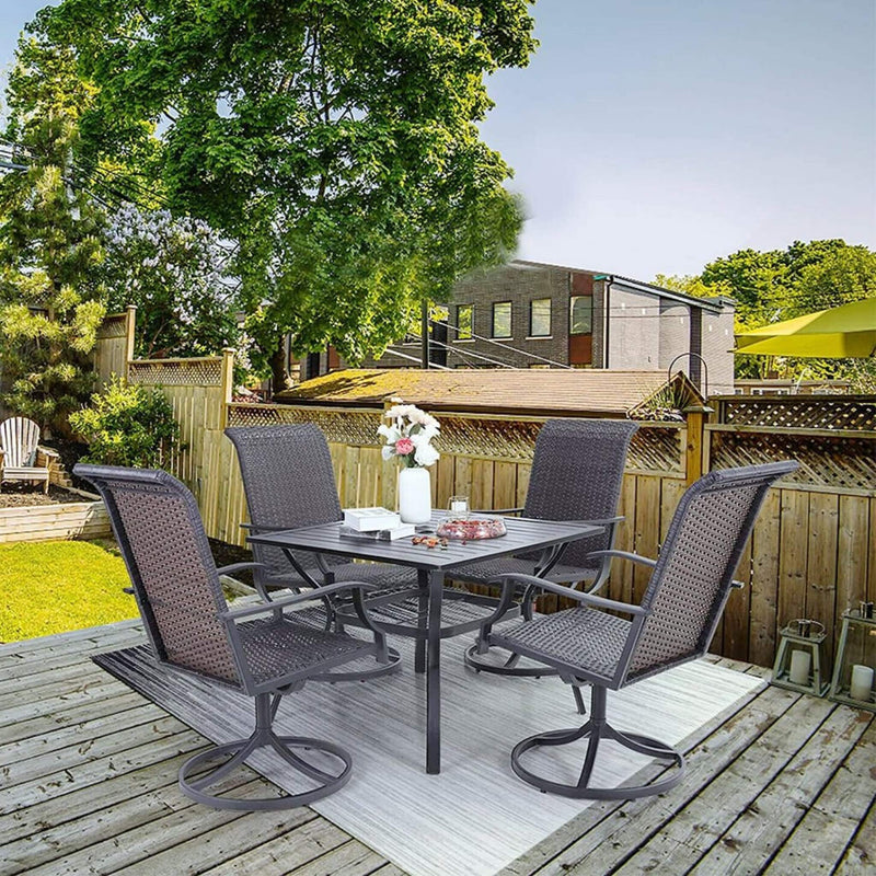 Outdoor patio set with table and chairs on a wooden deck