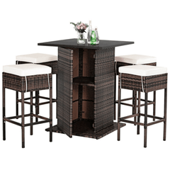 Outdoor patio set with a high table and four stools on a white background