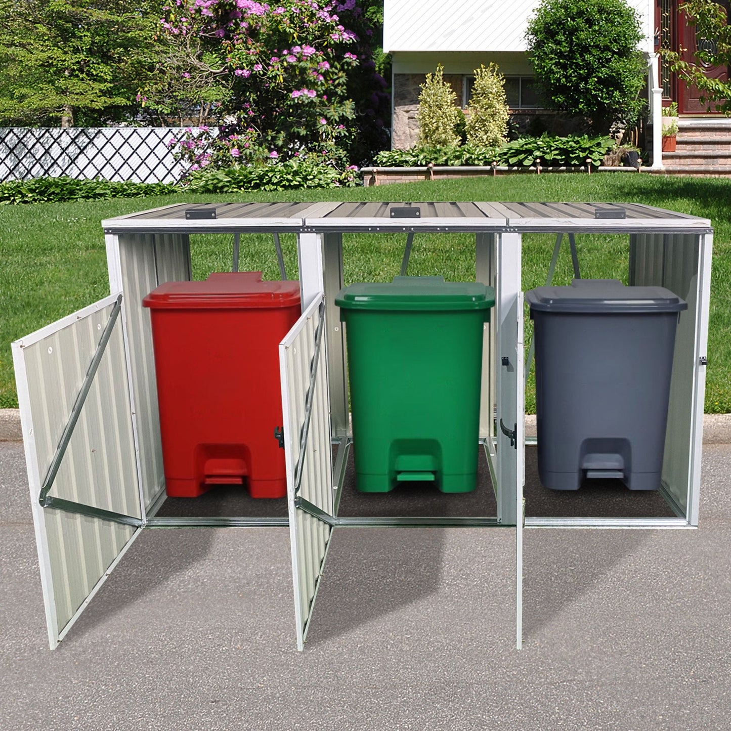 Outdoor trash bin storage unit with red, green, and gray bins on a driveway.