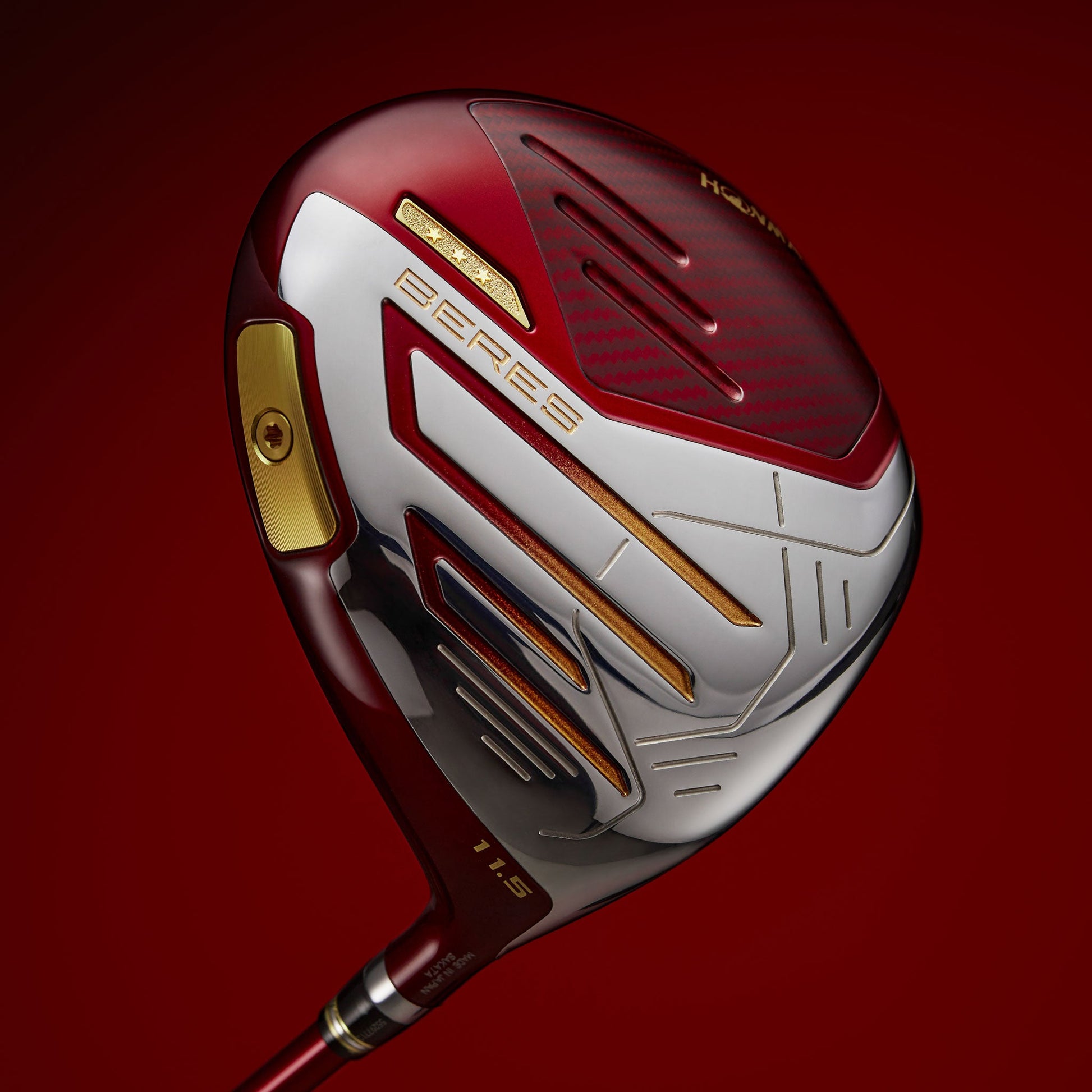 Golf club head with red and white design on a red background