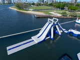Aquaglide La Jefa TR inflatable aquapark full structure – 50 foot commercial water park with climbing wall, slide and jump stations