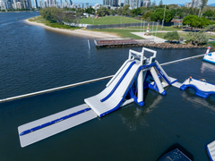 Aquaglide La Jefa TR inflatable aquapark full structure – 50 foot commercial water park with climbing wall, slide and jump stations