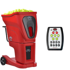 Red pitching machine with green balls and remote control on a white background