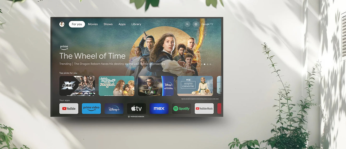 Mirage Vision Outdoor Smart TV displaying a streaming platform interface with various app icons on a white wall outdoors.
