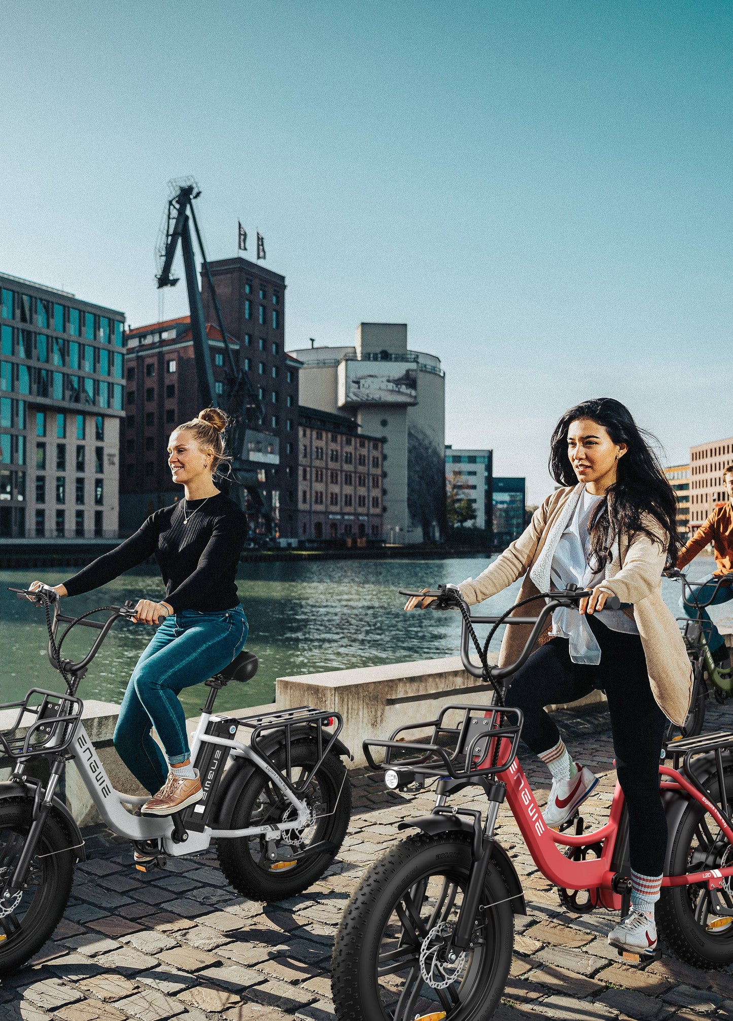 Engwe L20 step-through e-bike cruising in city street

