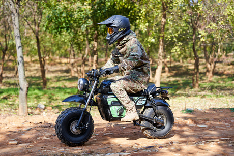 Child riding the MotoTec 60v 1500w Electric Mini Bike Lithium Black safely outdoors