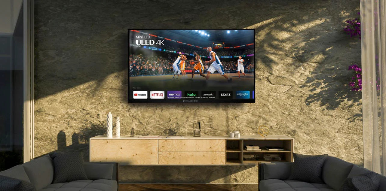 Smart outdoor TV displaying a basketball game in a modern living room with a wooden cabinet and gray sofa.