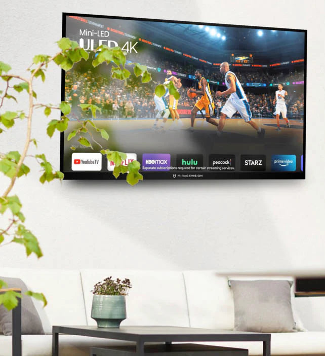 MirageVision outdoor smart TV displaying a sports game in a living room with a couch and plants.