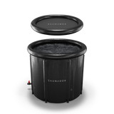 Black inflatable sauna with lid on a white background
