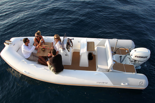 Zodiac Medline 5.8 RIB gliding across the water with family onboard


