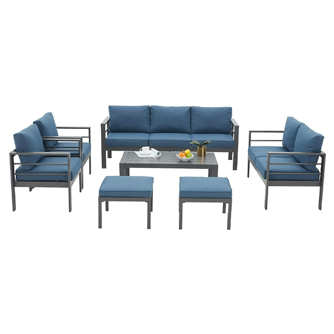 Outdoor furniture set with blue cushions on a white background