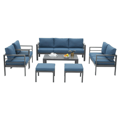 Outdoor furniture set with blue cushions on a white background
