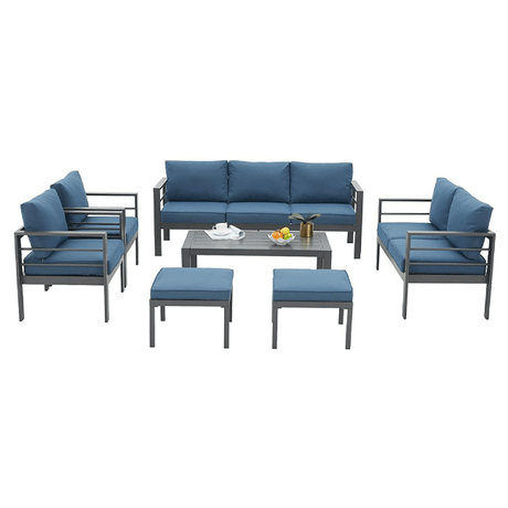 Outdoor furniture set with blue cushions on a white background