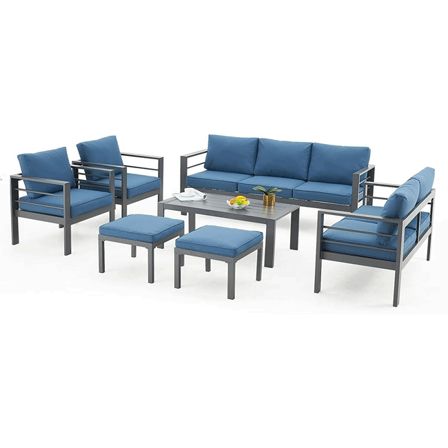 Outdoor furniture set with blue cushions on a white background
